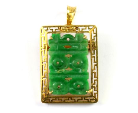A 22ct yellow gold (Chinese hallmark) pendant set with a carved jade character for double happiness, L. 3cm.