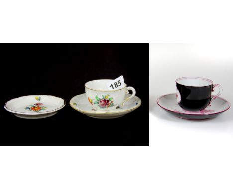 Two Nymphenburg porcelain cups and saucers and a further dish.