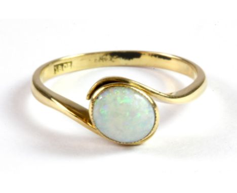 An 18ct yellow gold (stamped 18ct) opal set ring, (P).