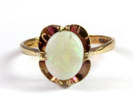 A 9ct yellow gold opal set ring, (M.5).