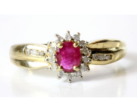 A 9ct yellow gold ruby and diamond set cluster ring, (N).