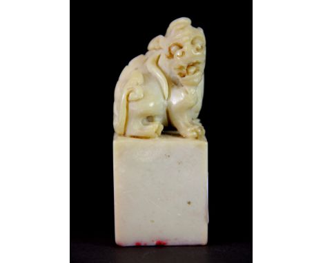 A Chinese carved soapstone seal mounted with a Qilin, H. 9cm.