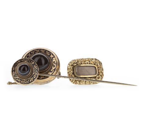 HARDSTONE SET BROOCH, Victorian and set with a cabochon black and white banded stone within a black enamelled border, along w