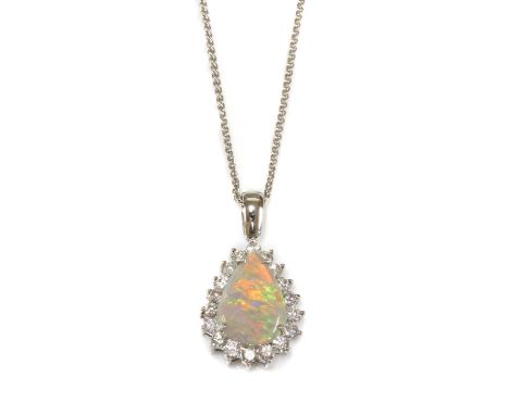 A white gold opal and diamond pear-shaped cluster pendant, the pear-shaped cabochon opal, with a stated weight of 2.39ct, cla