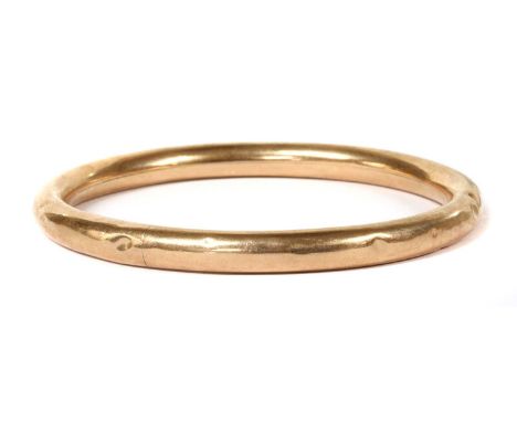 A 9ct gold bangle, of hollow round section, Birmingham, 73mm internal diameter, 18.26gCondition report: Surface marks/scratch