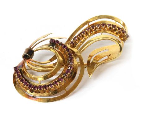 A gold paste set spray brooch, with pin and roller catch, marked 750, 60 x 33mm, 12.00gCondition report: Surface marks/scratc