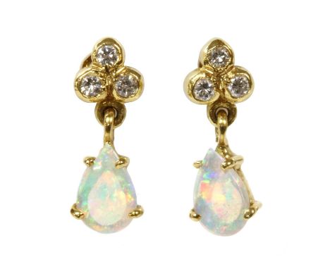 A pair of 18ct gold opal and diamond earrings, by Cropp &amp; Farr, a trefoil of brilliant cut diamonds, rub set, with a pear
