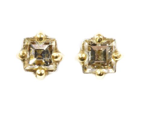 A pair of single stone diamond earrings, a square step cut diamond, claw set to post and butterfly fittings, 0.94g (2)Conditi