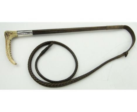 A silver mounted leather bound hunting crop
complete with thong.