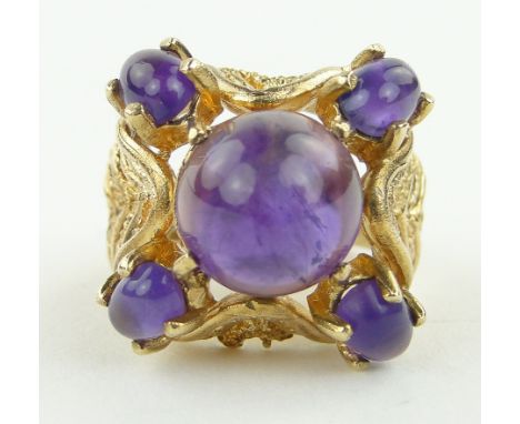 An unusual cabachon amethyst set cluster ring,
9ct gold settings 1973, 11.1gm gross.