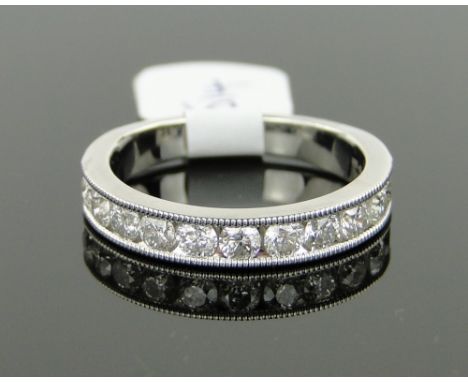 A platinum and diamond half eternity ring, size P.