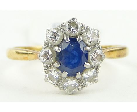 A sapphire and diamond cluster ring,
18ct and platinum settings, setting height 10mm, size M.