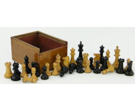 A turned wood Staunton chess set,
King height 3.5", with original box.