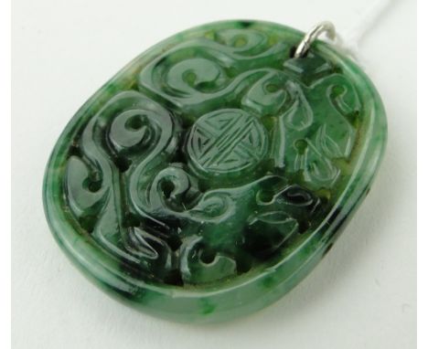 A Chinese carved and pierced jade pendant, height 35mm.