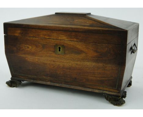 A rosewood sarcophagus tea caddy 
with fitted interior, length 12".
