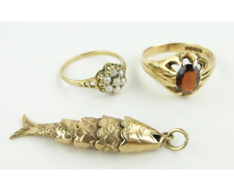 Gold pearl cluster ring,
gold garnet set ring and gold articulated fish pendant, (3).