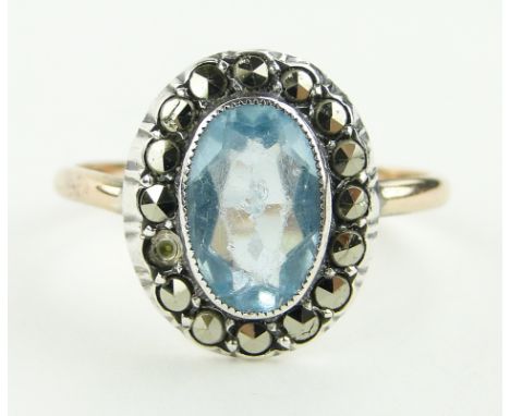 A 9ct gold topaz and marcasite set ring, setting height 15mm, size R.
