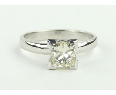 A Princess-cut solitaire diamond ring,
approx. 1ct, 14ct white gold settings, size M.