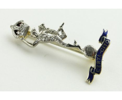 A diamond and enamel military insignia brooch,
14ct gold and platinum settings, height 32mm.