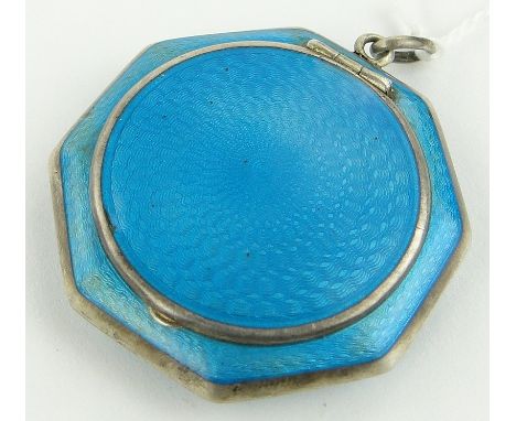 A Continental silver and blue enamel miniature compact,
marked 925, 4cm across.