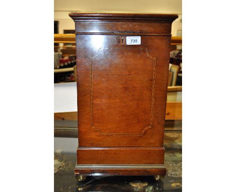 A late Victorian mahogany and satinwood strung wine cooler,
with liner having brass ring handles and brass ball feet, width 1