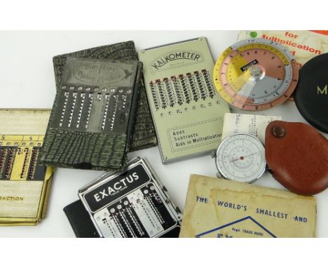 6 Vintage pocket adding machines.