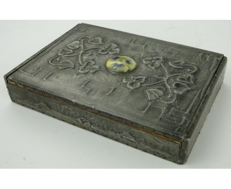 A pewter clad box
with ceramic pansy motif, length 8".