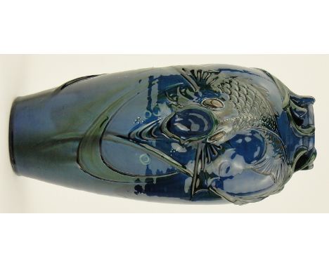 A Brannam Barum pottery vase
with moulded and pierced design of a fish amongst weeds, signed F B, height 14.25".