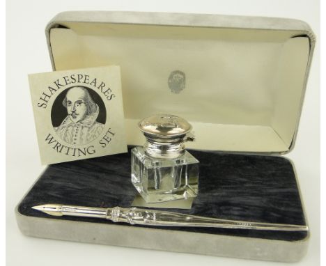 A silver mounted glass inkwell and dip pen, cased.