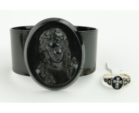 Victorian unmarked gold mourning ring
with black enamels and pearls, together with a Victorian mourning bracelet, (2).