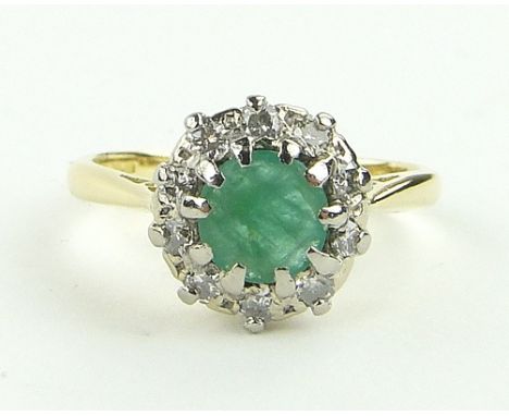 18ct emerald and diamond cluster ring,
setting height 10mm, size N.