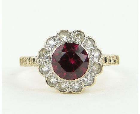 A 9ct gold gemstone set cluster ring,
setting height 11mm, size N.