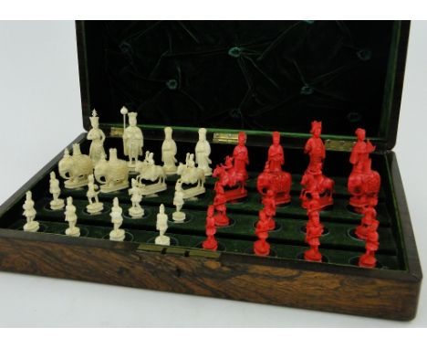A rosewood cased set of ivory chess pieces,
King height 3.8".