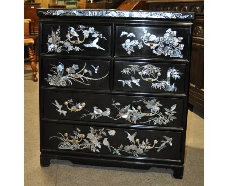 A black lacquered Malaysian square chest,
fitted with 4 short and 2 long drawers, having ornate mother of pearl and abalone i