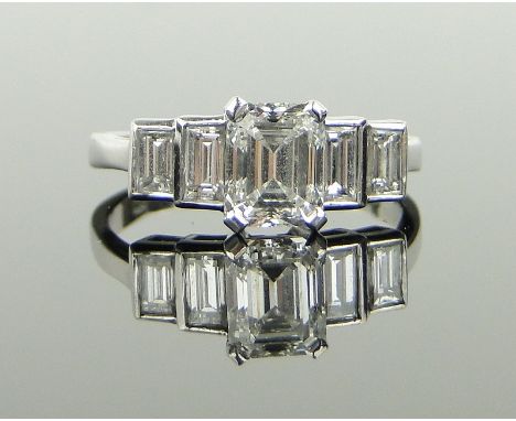 A 5 stone emerald-cut diamond ring,
centre stone approx. 1.35cts, shoulder stones approx. 0.74cts total, 18ct white gold sett