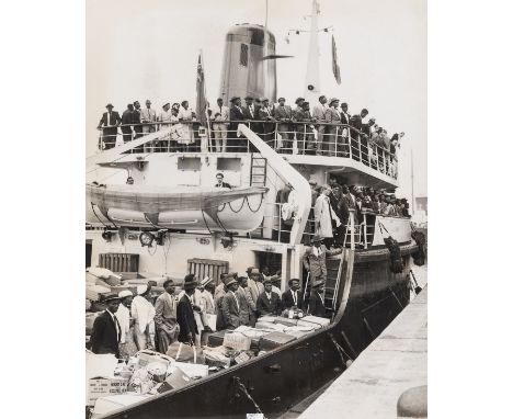 Windrush.- 16 press photographs documenting the arrival of the Windrush generation of West Indian immigrants, laminated, capt