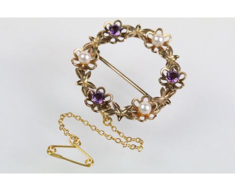 9ct gold amethyst and pearl brooch of round form set with three round cut amethysts and three cultured pearls. Hallmarked Bir