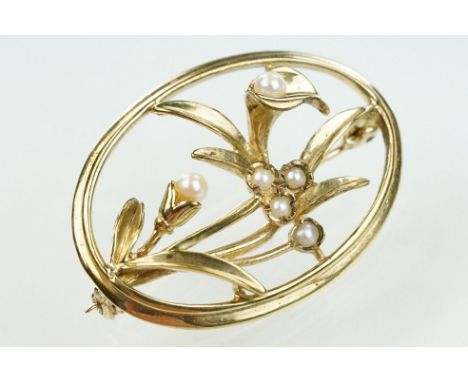 9ct gold and seed pearl floral brooch. The brooch of oval form with a floral spray to centre set with seed pearls. Import mar