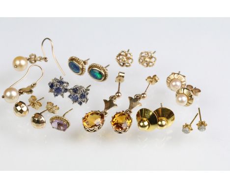 Collection of assorted yellow metal earrings. The lot to include opal doublet stud earrings, citrine drop earrings, pearl ear