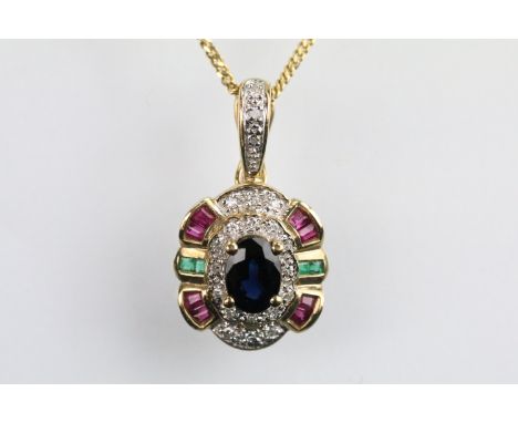 9ct gold sapphire, ruby, emerald and diamond pendant set with an oval cut sapphire to centre surrounded with round cut diamon