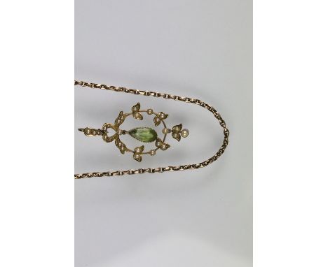 Early 20th Century Edwardian 15ct gold peridot and seed pearl pendant having an open work foliate design pendant with a pear 