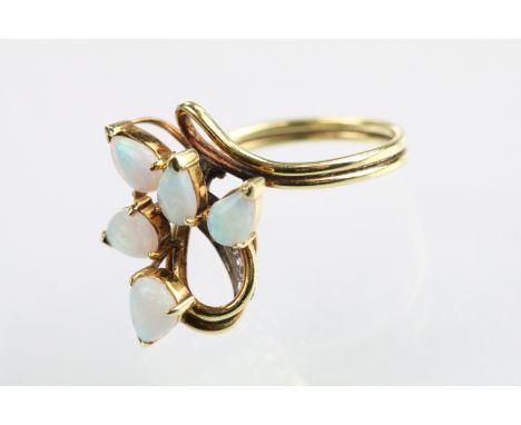 18ct gold and opal ring set with five tear drop shaped opal cabochons with diamond accent stones. Marked 18k. Size M.5. 