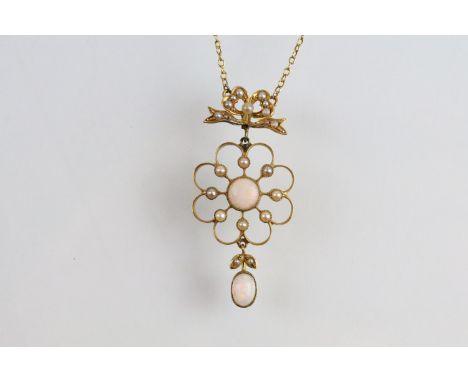 Early 20th Century 15ct gold and opal open work pendant necklace. The necklace having a round opal cabochon to centre surroun