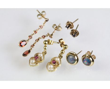 Four pairs of 9ct gold earrings to include a pair of sapphire stud earrings, a pair of synthetic opal stud earrings, a pair o