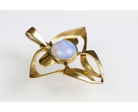 Early 20th Century Art Nouveau 9ct gold and opal pendant of whiplash form with a round opal cabochon to the centre. Measures 