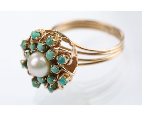 Cultured pearl and turquoise cluster ring having a half pearl set to centre surrounded by green and blue half cabochons. Yell