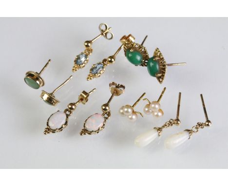 Six pairs of 9ct gold stud earrings to include two pairs of opal drop earrings, a pair of jade stud earrings, pair of green s