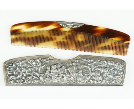 An antique sterling silver repoussé pattern hair comb and case.