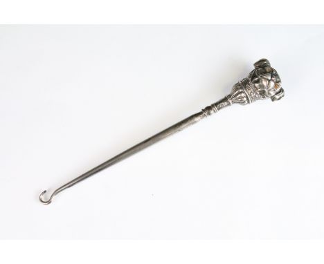 Early 20th Century Edwardian silver novelty button hook having a handle in the form of a pug dog with glass eyes (two missing