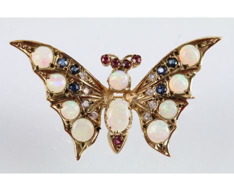 9ct gold hallmarked opal, diamond, sapphire and ruby butterfly brooch. The brooch set with with two opal cabochons to the bod